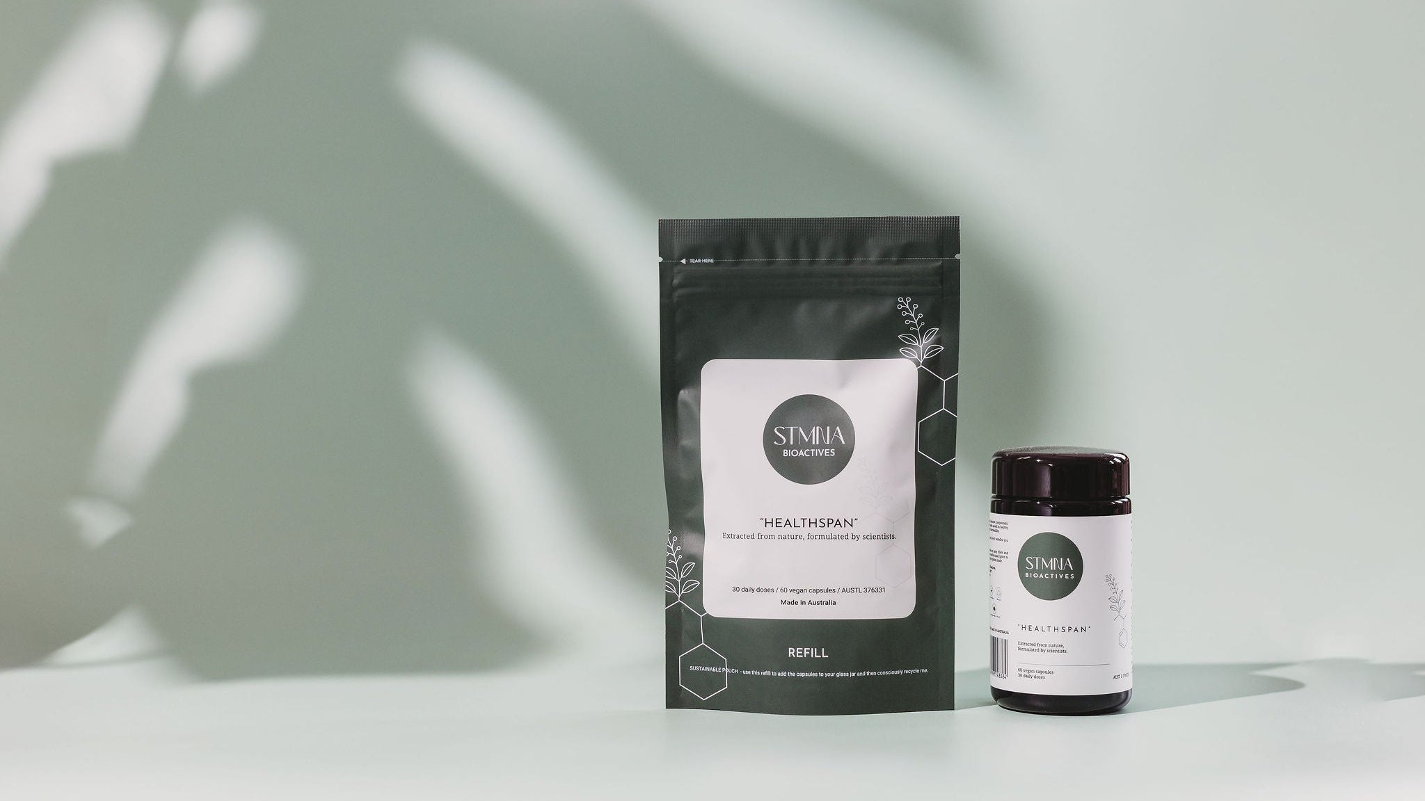 STMNA Bioactives refill pouch and jar  with labels on a light background